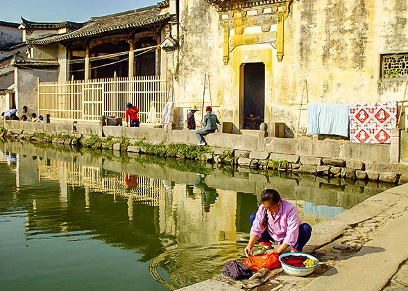 Local People Washing Clothes by the Pond