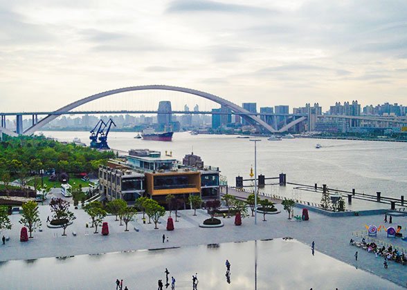 Shanghai Lupu Bridge seen from Expo Park at dusk