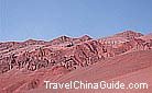 Under the bright sunshine, the Flaming Mountain looks rust red.