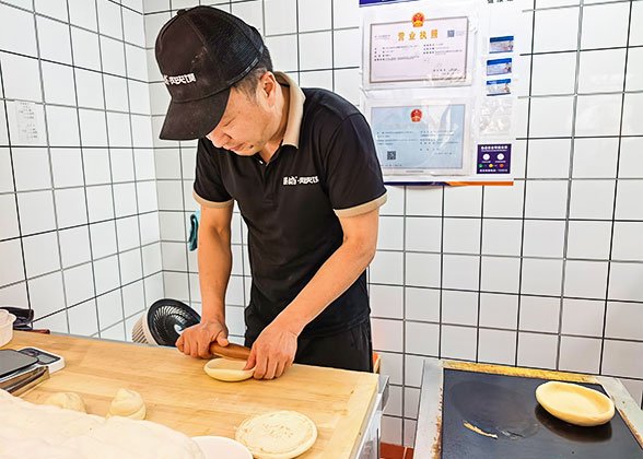 Rolling the Dough into Flat Rounds Rolling the Dough into Flat Rounds