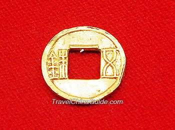 Gold coin inscribed with characters
