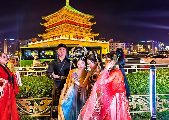 Tourists wearing Hanfu in front of the Bell Tower