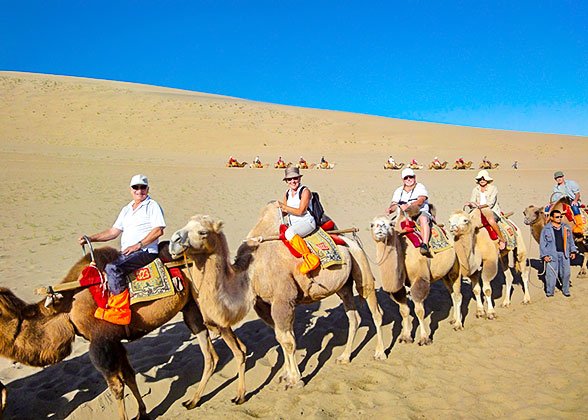 Riding Camels at Echoing-Sand Dune Riding Camels at Echoing-Sand Dune