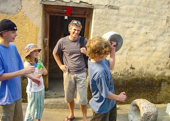 Children Try Lifting a Stone Farm Tool Children Try Lifting a Stone Farm Tool