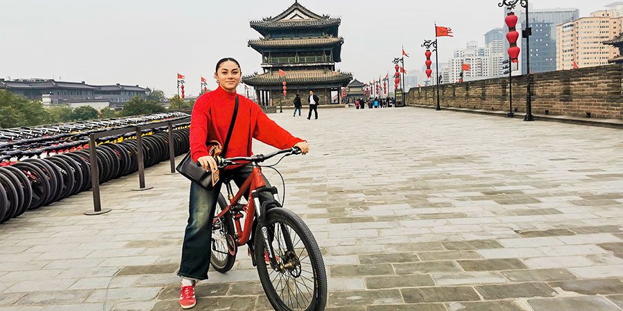 Tourist Biking in City Wall
