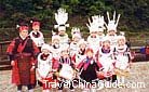 Miao mothers and kids dress in traditional costumes to celebrate their festival, Guizhou